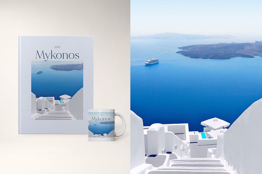 Un mug et un livre photo personnalisé intitulé 'Mykonos', montrant une image de l'île, dans le design My Travelogue de Photobox, où le titre, la destination et la couleur de couverture sont tous personnalisables.